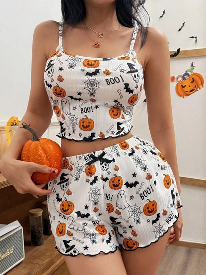 Woman wearing white pumpkin print Halloween loungewear set with cami top and shorts